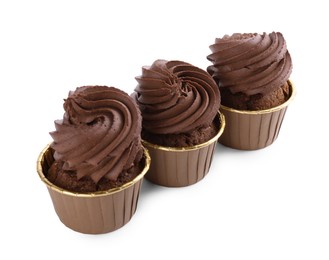 Photo of Three delicious chocolate cupcakes isolated on white