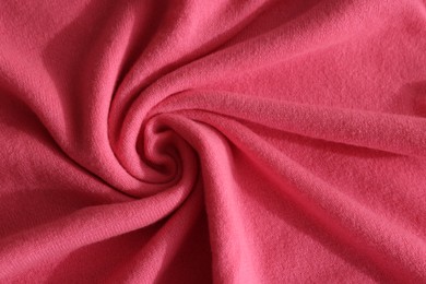 Beautiful pink fabric as background, top view