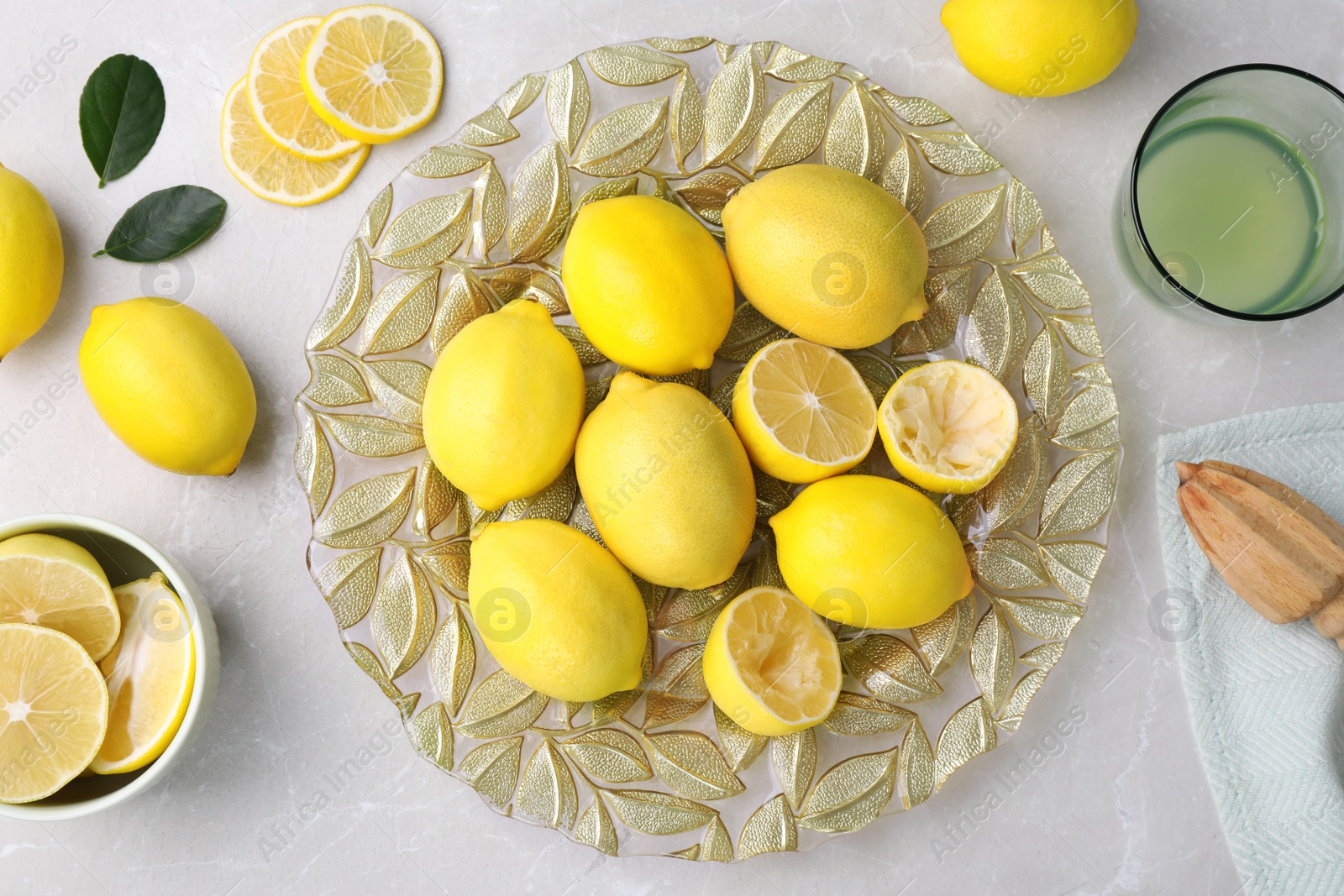 Photo of Flat lay composition with fresh lemons on light grey table