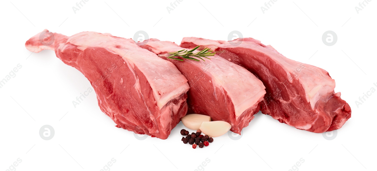 Photo of Pieces of raw beef meat and spices isolated on white