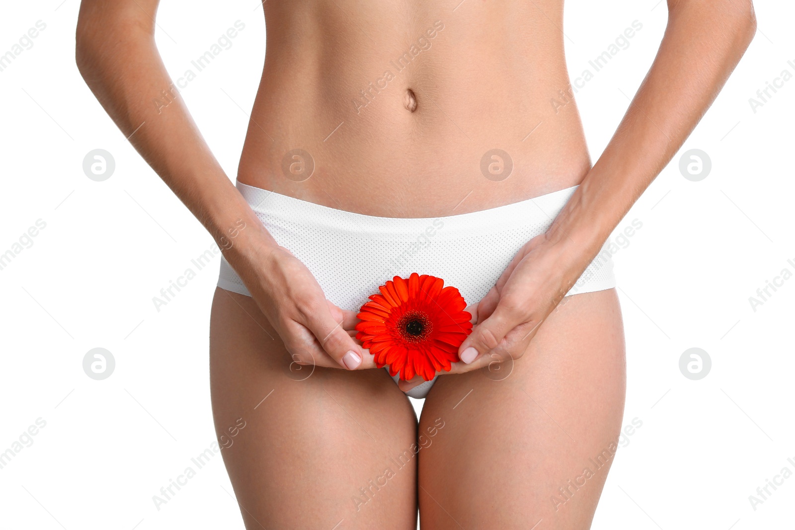 Photo of Young woman with gerbera flower on white background. Gynecology concept