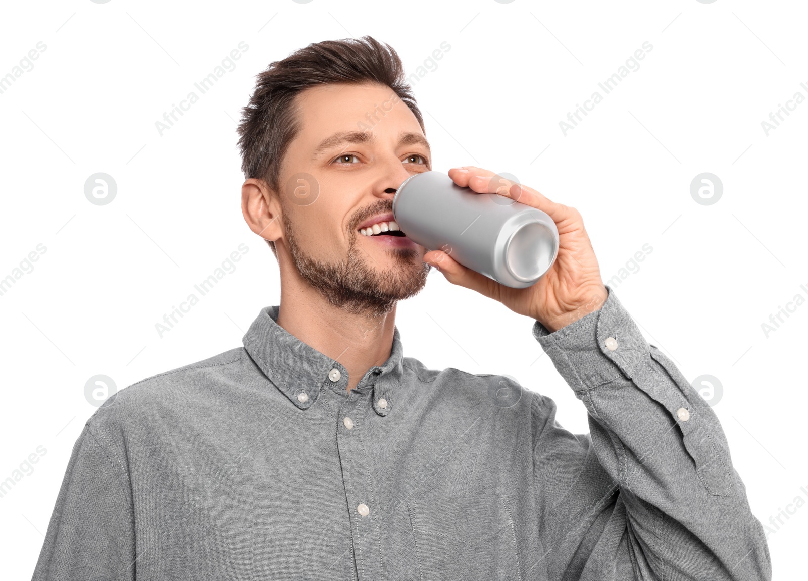 Photo of Happy man drinking from tin can on white background