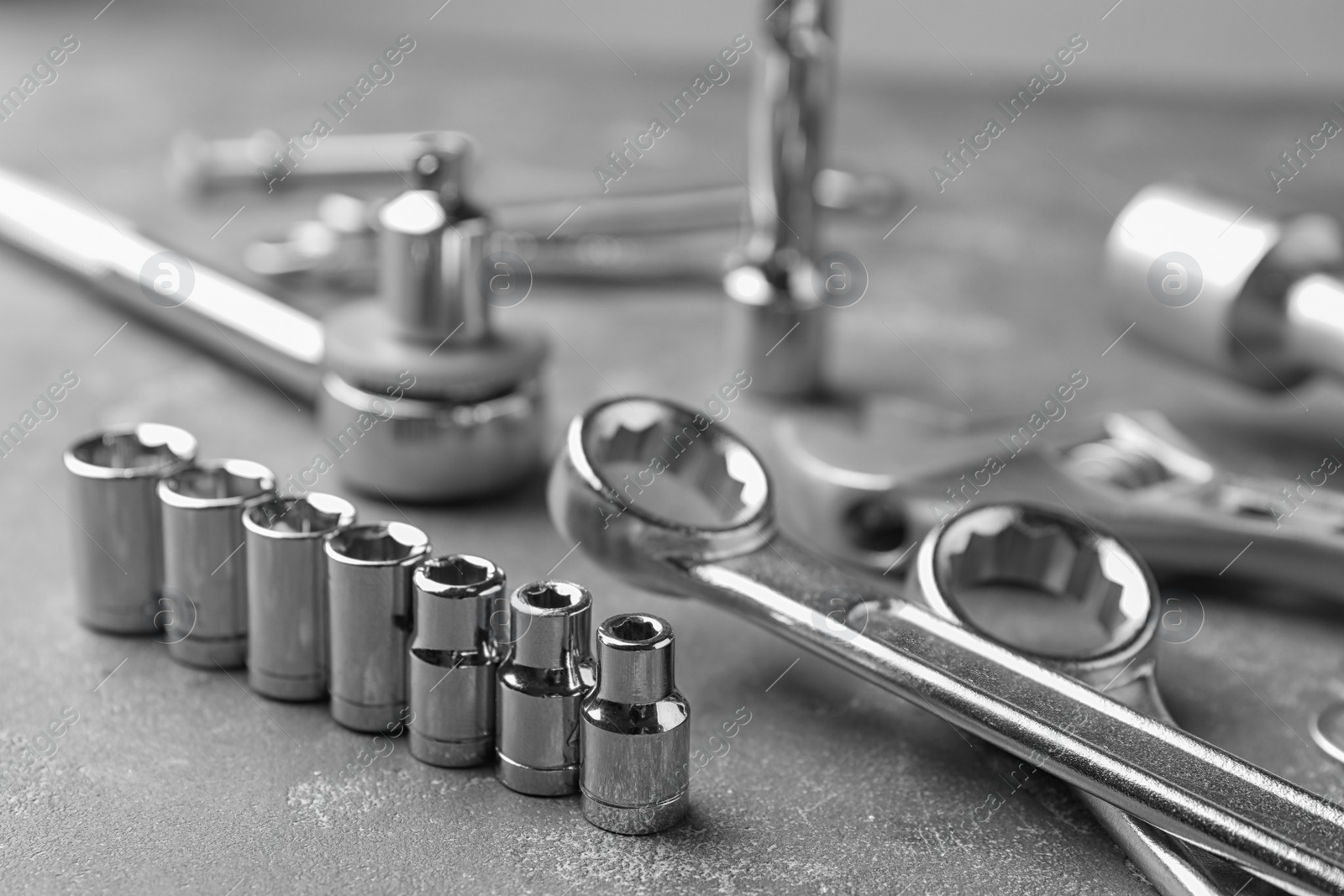 Photo of Auto mechanic's tools on grey stone table