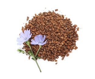 Pile of chicory granules and flowers on white background, top view