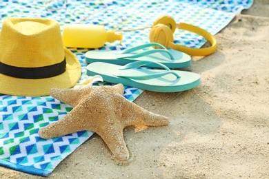 Photo of Composition with bright beach accessories on sand