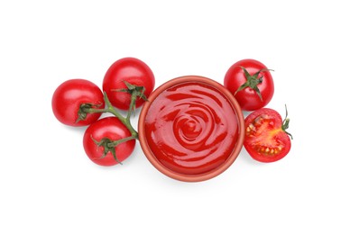 Photo of Bowl with tasty ketchup and fresh tomatoes isolated on white, top view