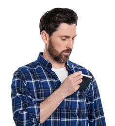 Photo of Man putting cigarette case into pocket isolated on white