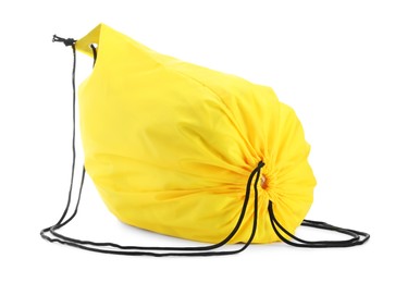 Photo of One yellow drawstring bag isolated on white