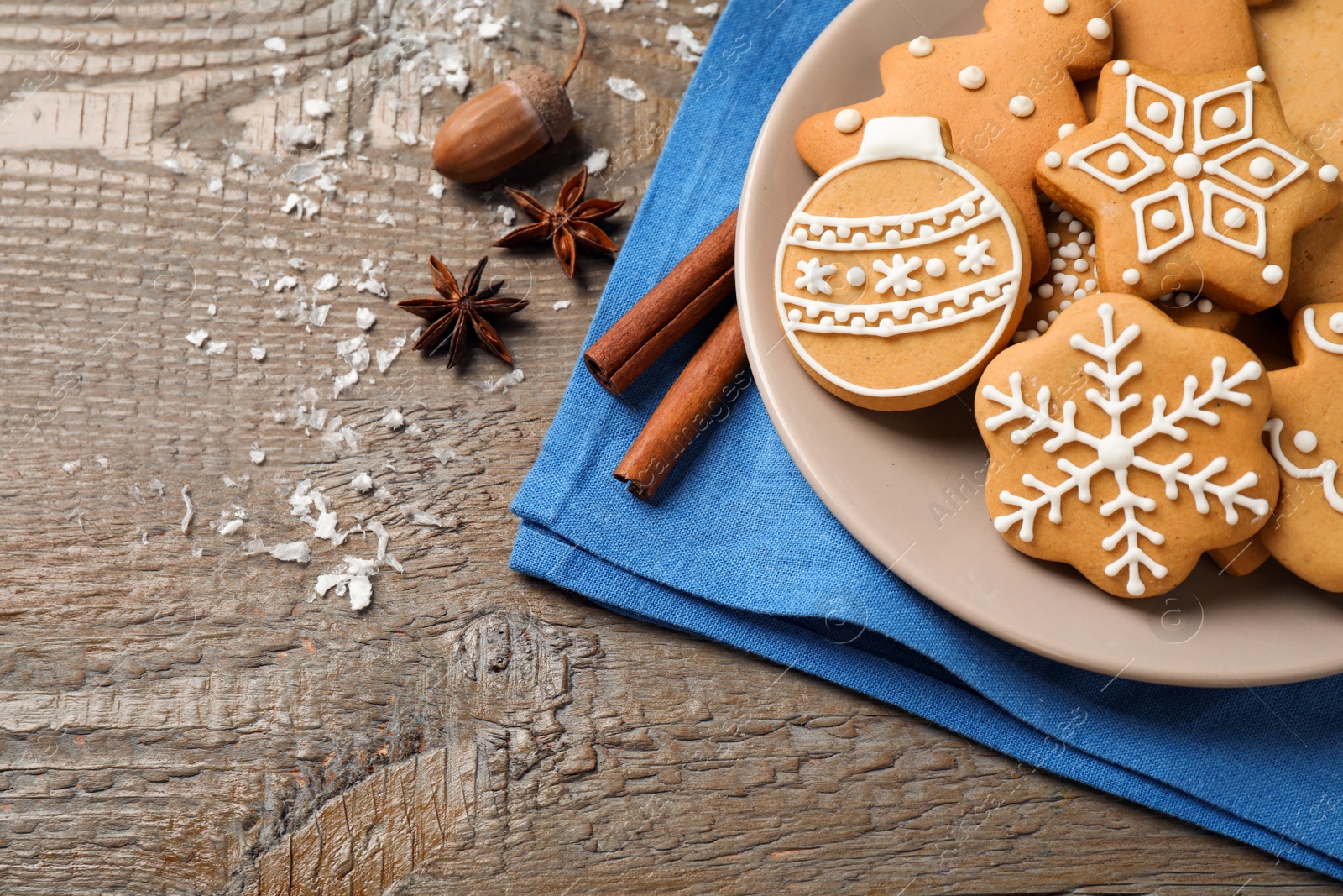 Photo of Tasty homemade Christmas cookies on wooden table, top view