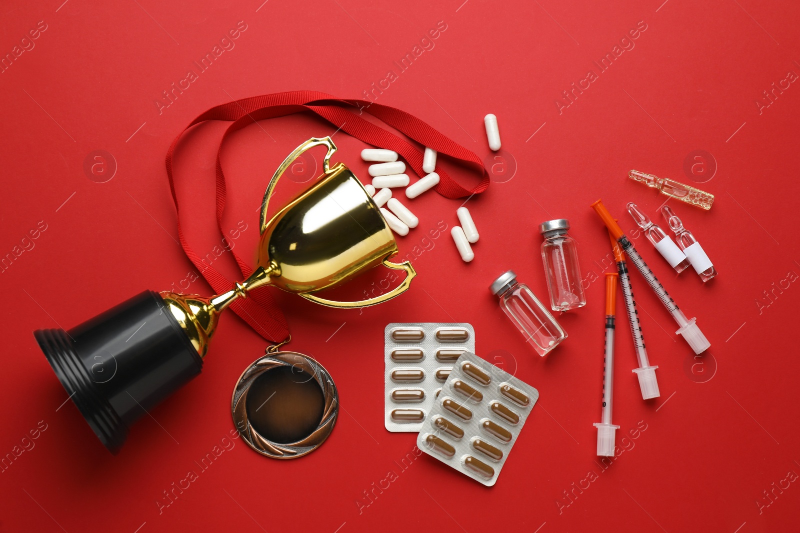 Photo of Flat lay composition with drugs on red background. Doping control