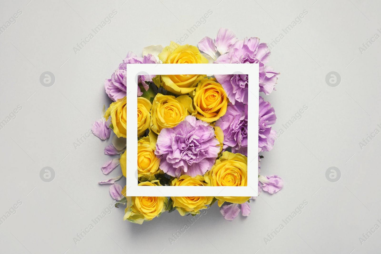 Photo of Flat lay composition with beautiful blooming flowers on grey background