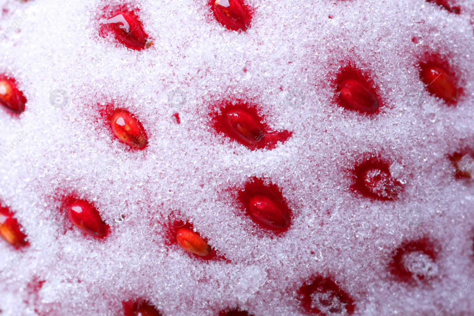 Photo of Texture of frozen ripe strawberry, macro view