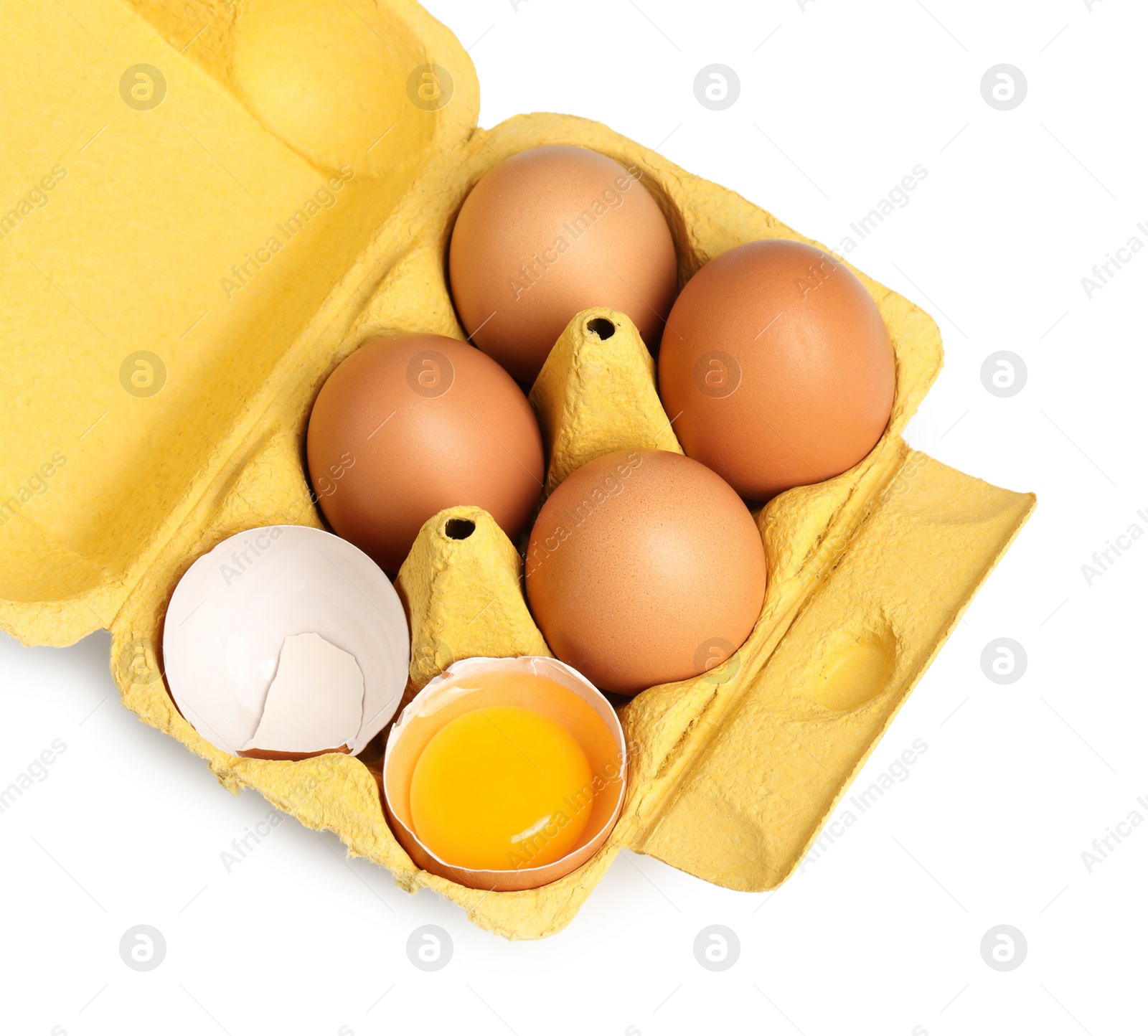 Photo of Chicken eggs in carton isolated on white, top view