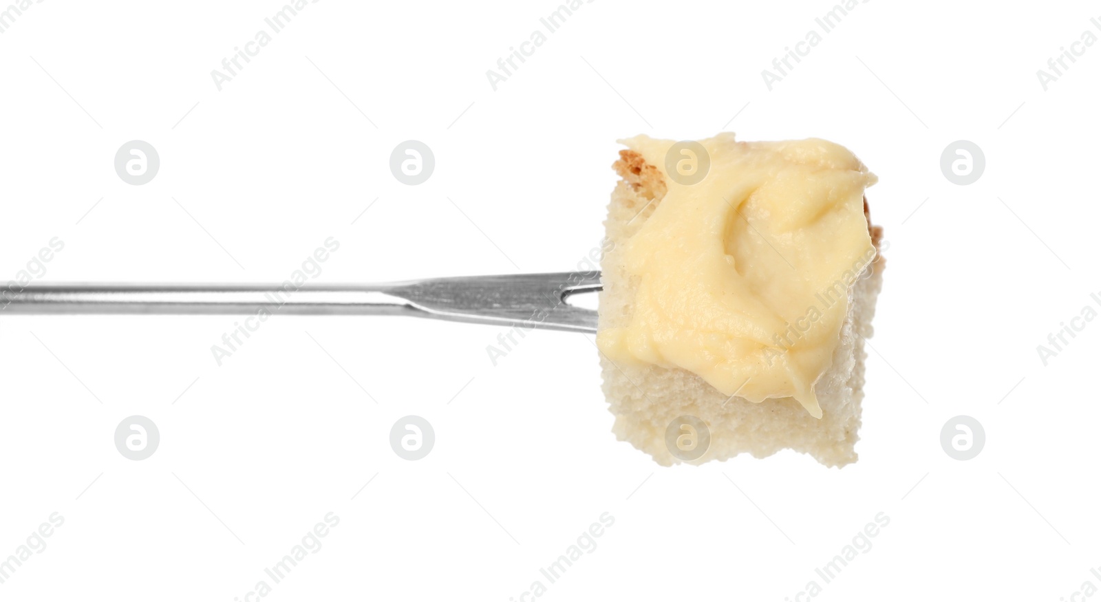 Photo of Tasty fondue. Fork with piece of bread and melted cheese isolated on white