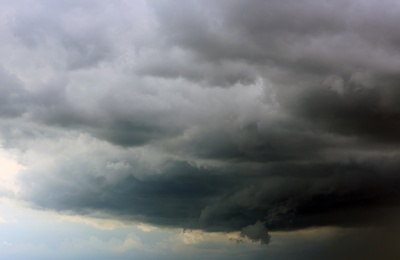 Sky with heavy rainy clouds on grey day