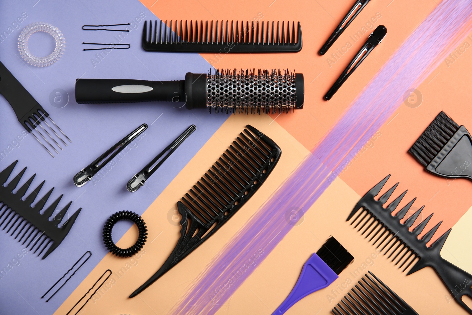 Photo of Flat lay composition with hair salon tools on color background