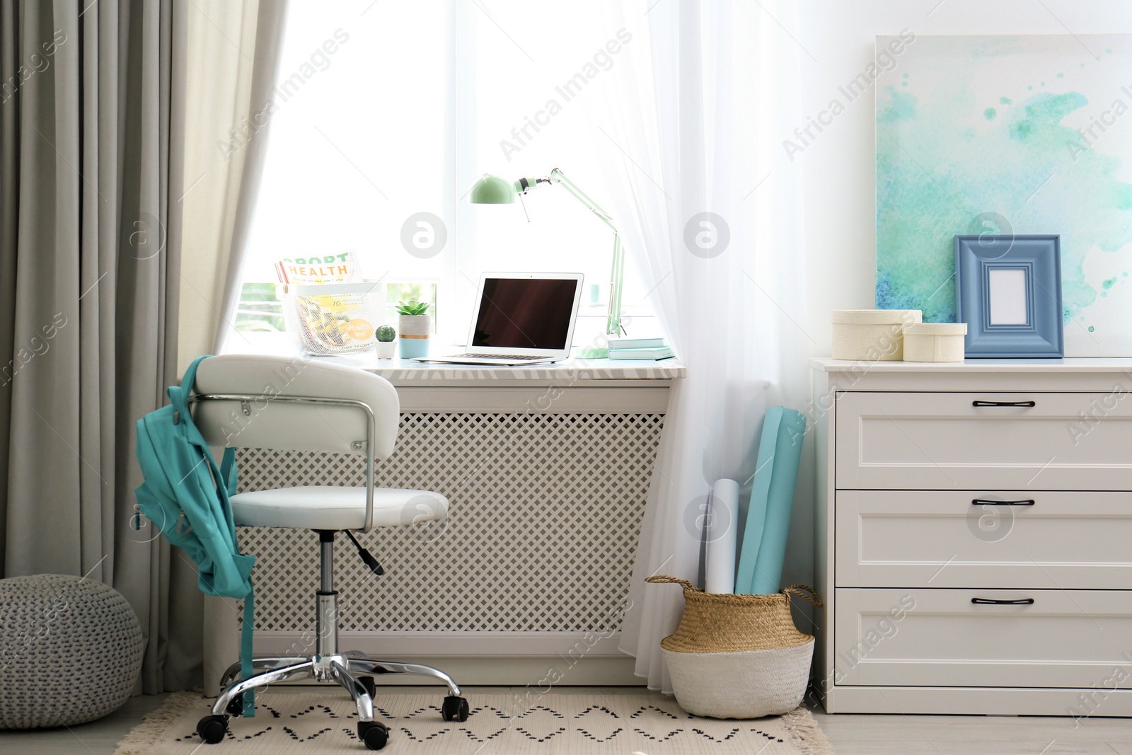 Photo of Comfortable workplace with laptop on window sill at home