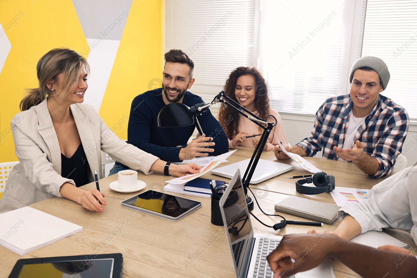 Photo of Team of employees working together in office. Startup project