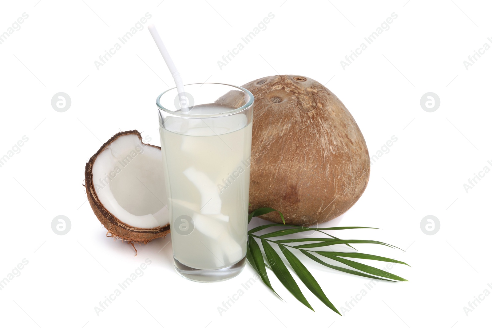 Photo of Glass of coconut water, leaf and nuts isolated on white