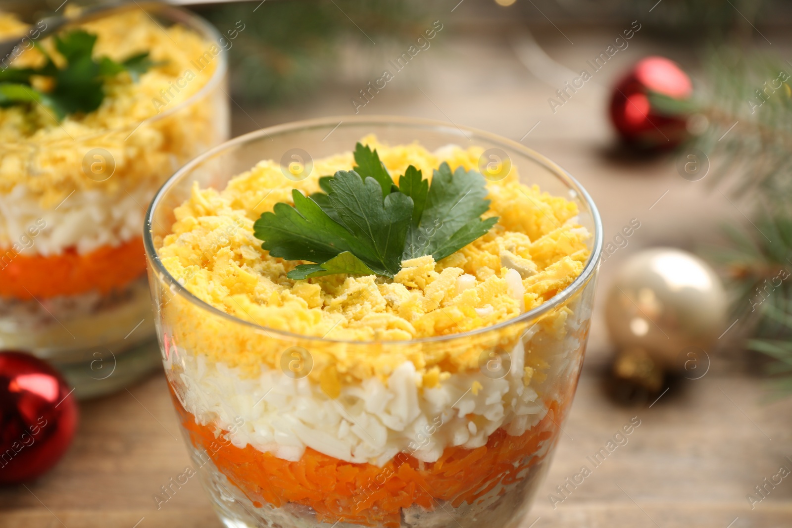 Photo of Traditional russian salad Mimosa on table, closeup