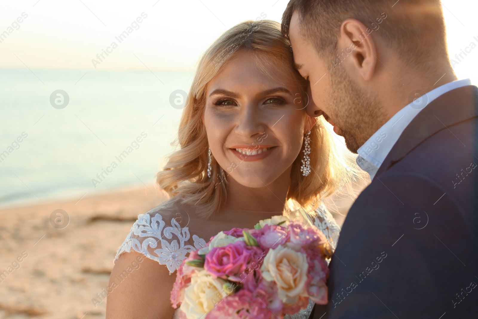 Photo of Wedding couple. Bride and groom on beach