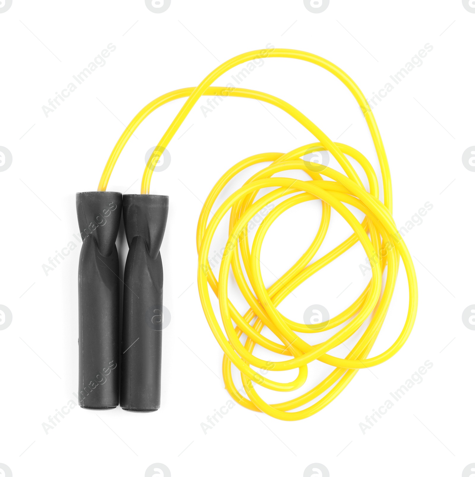 Photo of Yellow skipping rope isolated on white, top view. Sports equipment