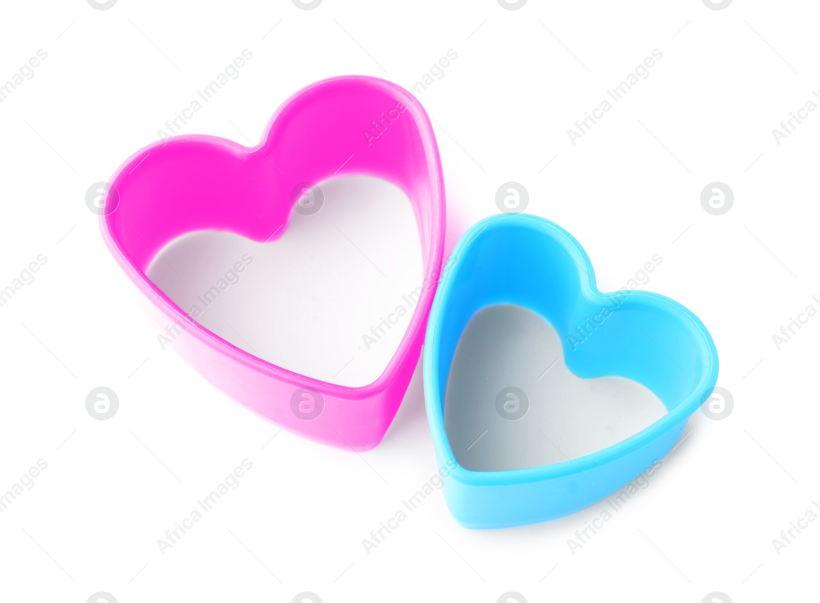 Photo of Heart shaped cookie cutters on white background