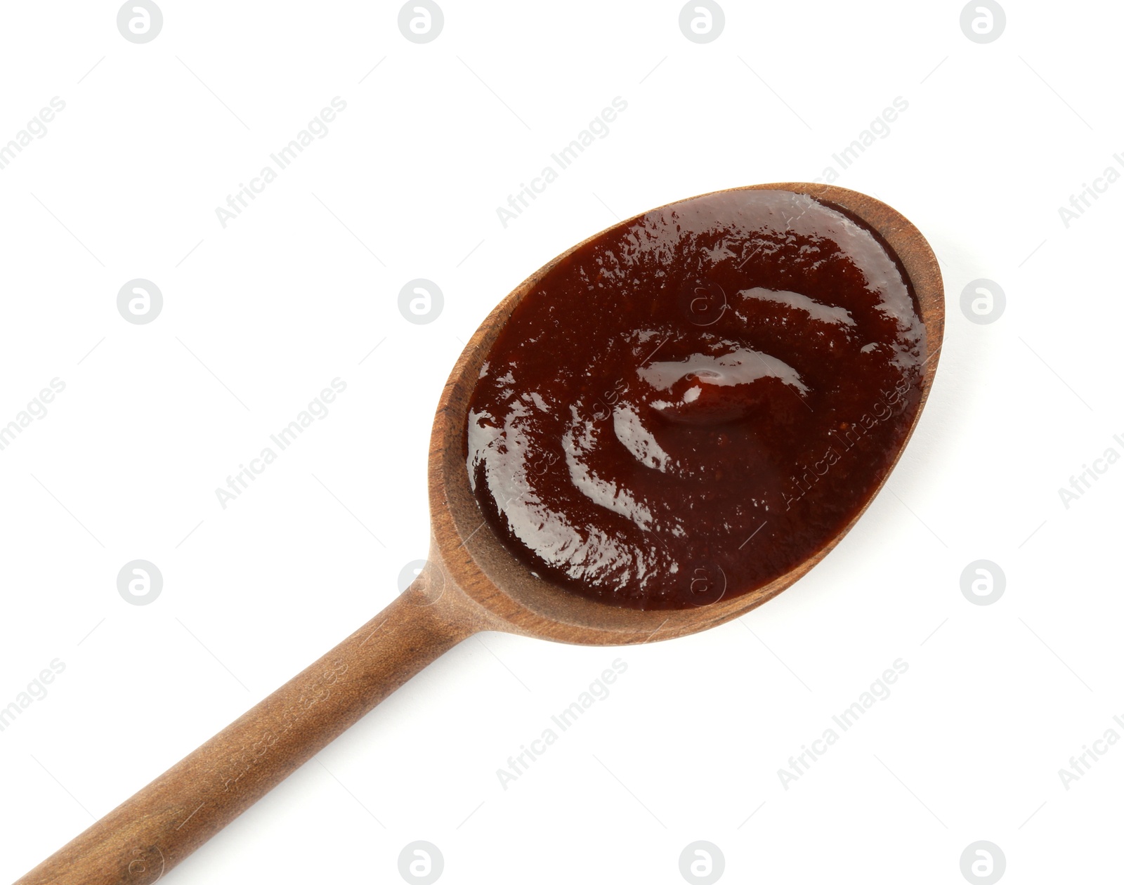 Photo of Spoon with hot barbecue sauce on white background