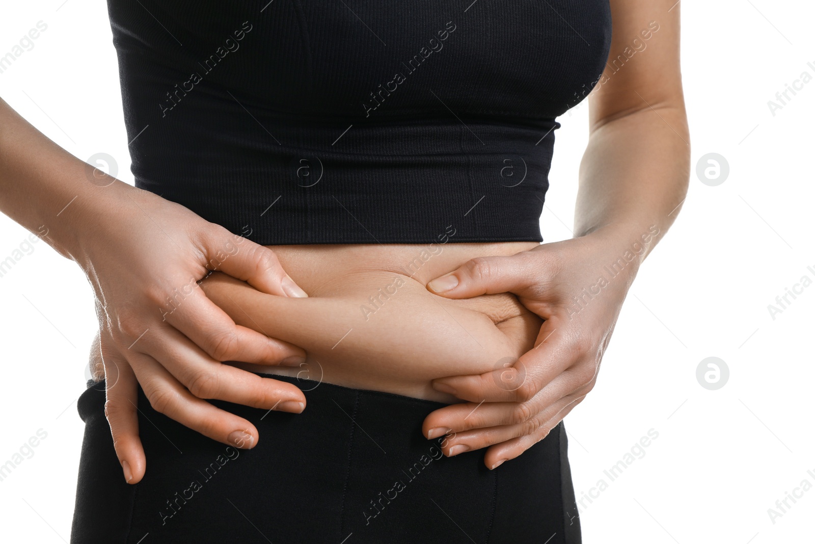 Photo of Woman touching belly fat on white background, closeup. Overweight problem