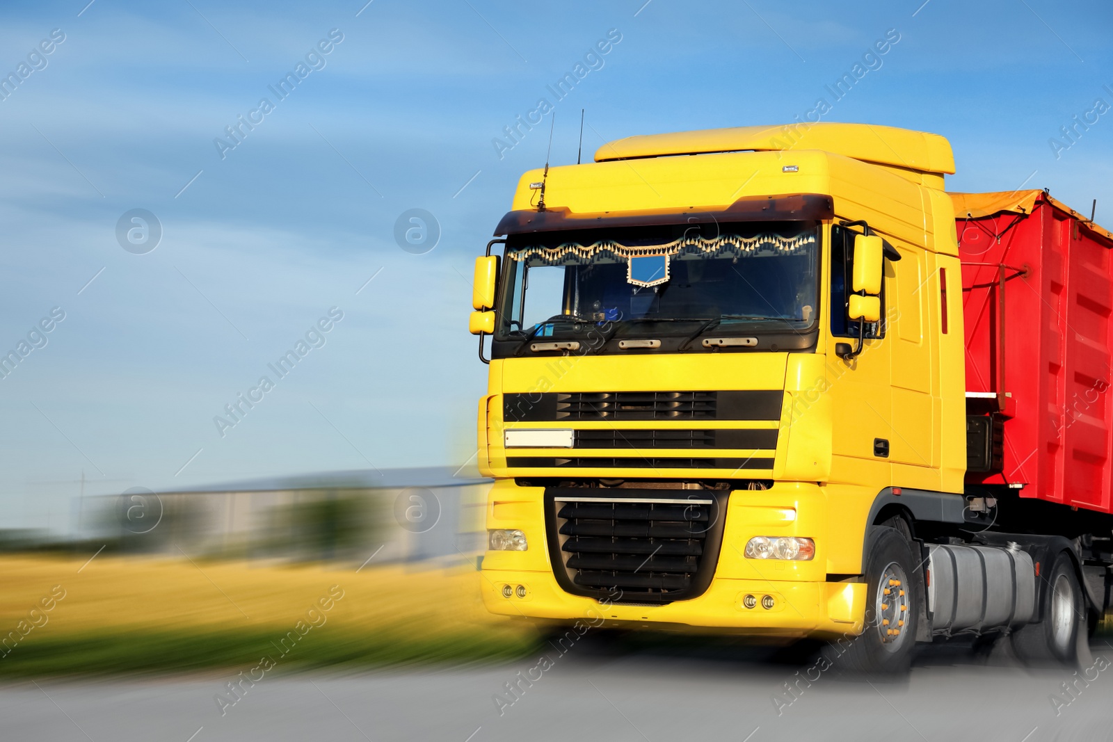 Image of Logistics concept. Truck on country road, motion blur effect 