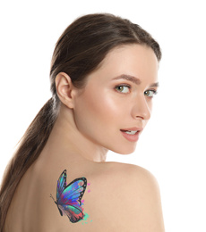 Young woman with colorful tattoo of butterfly on her body against white background