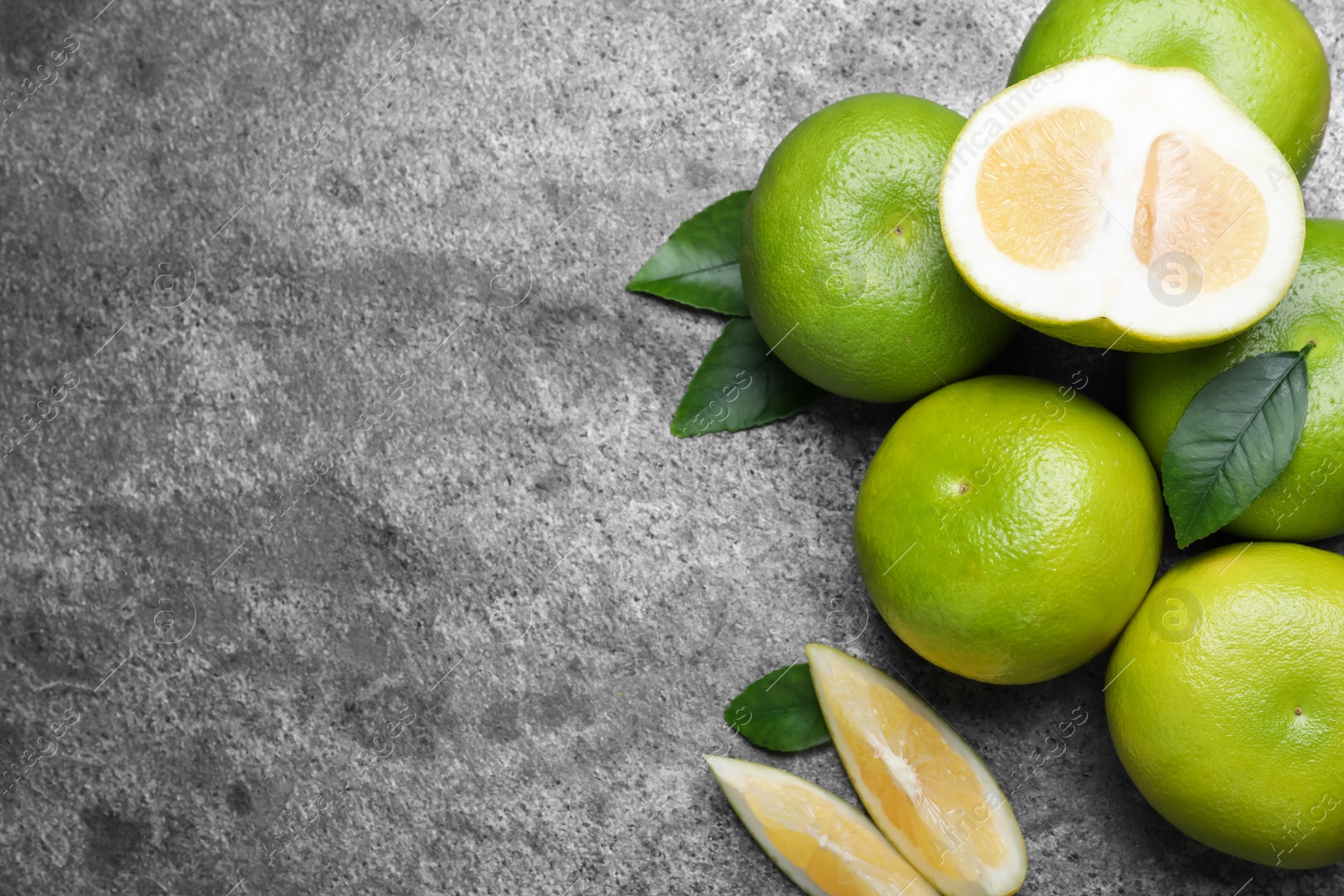 Photo of Fresh ripe sweeties on grey table, flat lay. Space for text