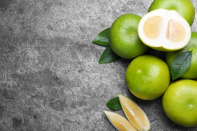 Photo of Fresh ripe sweeties on grey table, flat lay. Space for text