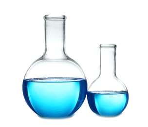 Photo of Flasks with blue liquid on table against white background. Laboratory analysis