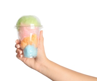 Photo of Young woman holding plastic cup with cotton candy on white background, closeup