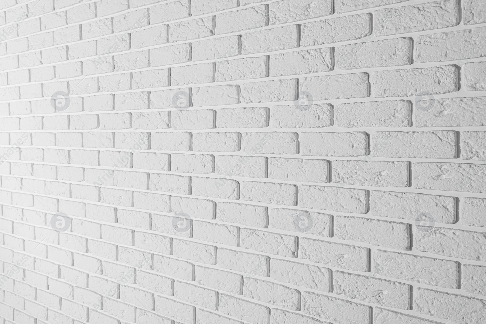Photo of Texture of white brick wall as background, closeup