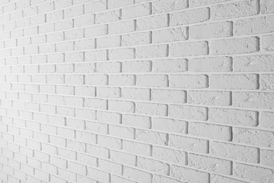 Photo of Texture of white brick wall as background, closeup