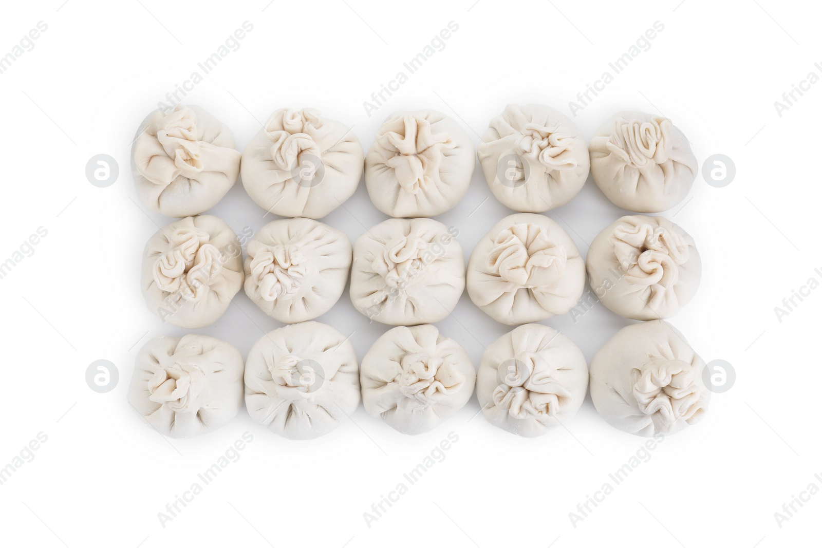 Photo of Many uncooked khinkali (dumplings) isolated on white, top view. Georgian cuisine