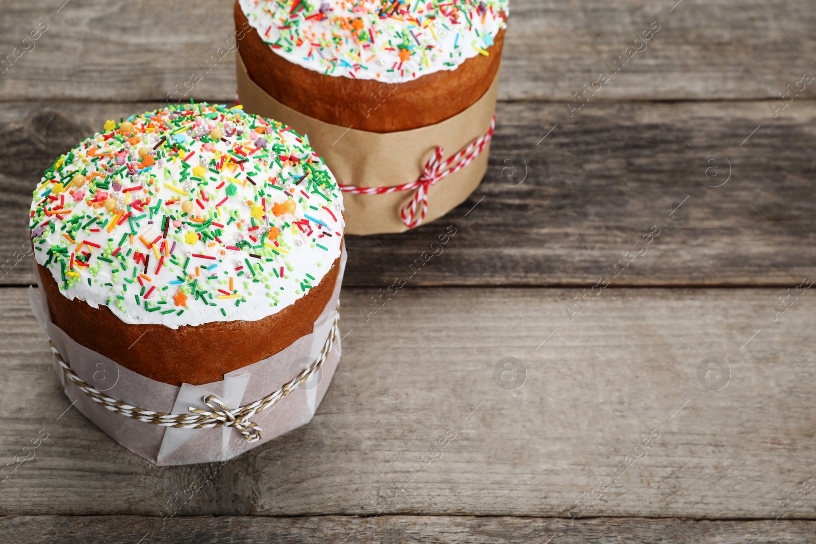 Photo of Traditional Easter cakes with sprinkles, space for text