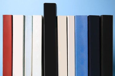 Collection of books on light blue background