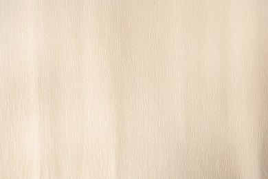 Texture of beige paper sheet as background, closeup