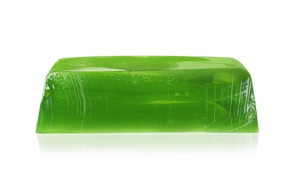 Photo of Piece of green jelly on white background