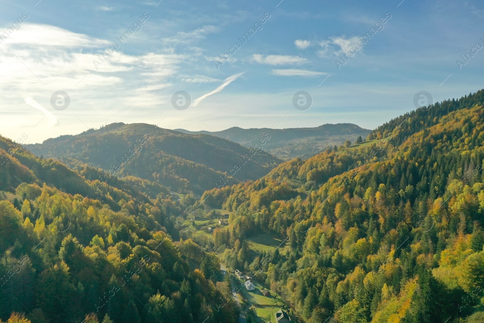 Photo of Aerial view of beautiful mountain forest and village on autumn day