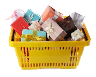 Photo of Shopping basket full of gift boxes on white background