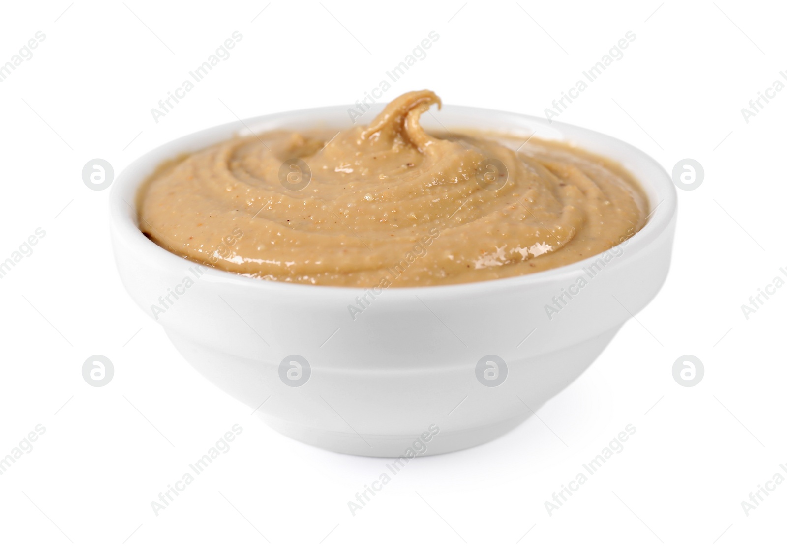 Photo of Delicious nut butter in bowl isolated on white