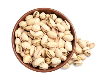 Photo of Tasty organic pistachio nuts in bowl on white background, top view