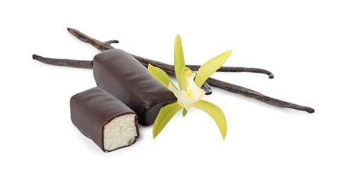 Glazed curd cheese bars, vanilla pods and flower isolated on white