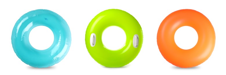 Set with colorful inflatable rings on white background, top view. Banner design