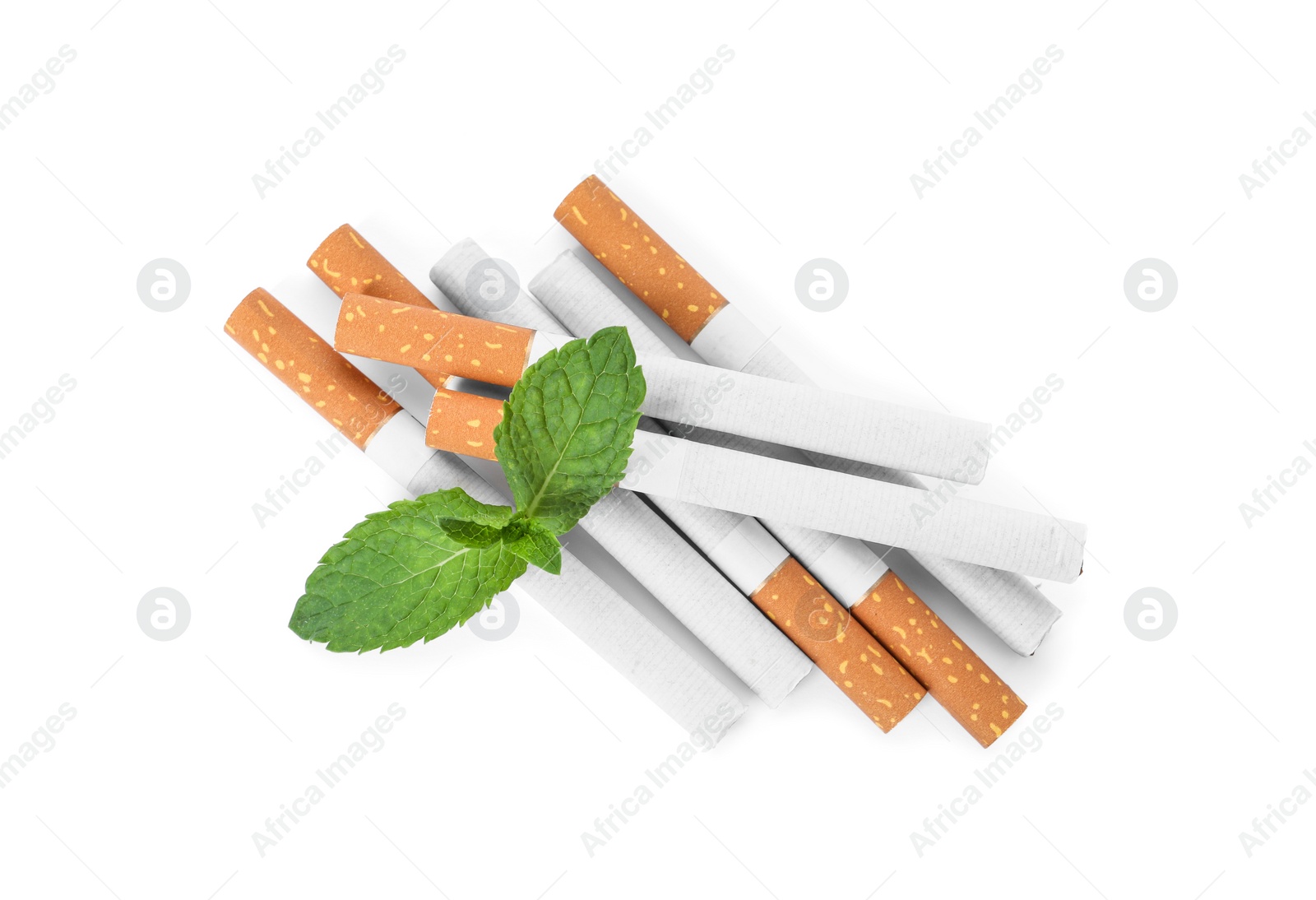 Photo of Menthol cigarettes and fresh mint leaves on white background, flat lay