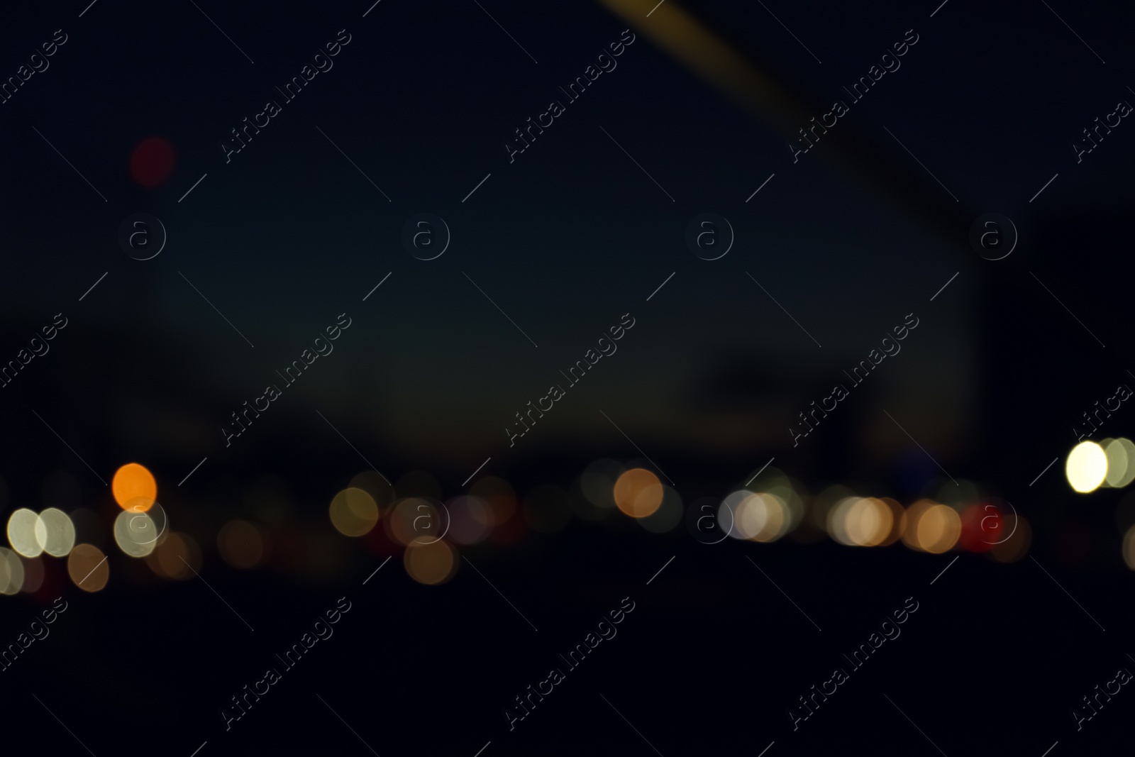 Photo of Blurred view of city lights at night. Bokeh effect